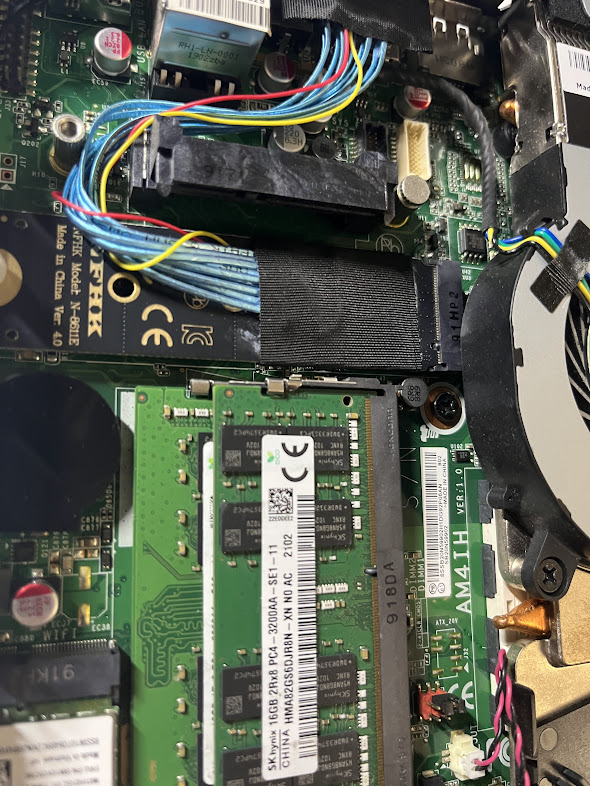 Internal view: OCuLink adapter and cable routing inside the mini PC