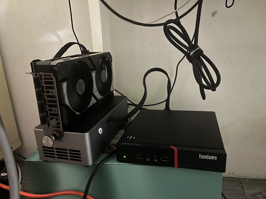 Complete desk setup with ThinkCentre mini PC and external GPU enclosure